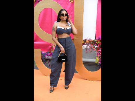 Ymonne Wilson, owner of Ymonne’s Closet, swipes right on a structured two-piece set from her boutique, accessorised with a mini top-handle bag and sleek sunglasses.
