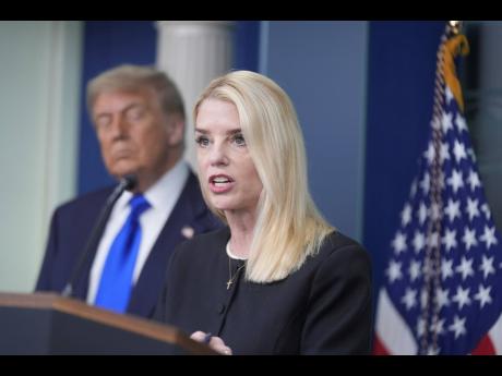 Attorney General Pam Bondi speaks to the media, Friday, June 27, 2025, in the briefing room of the White House in Washington, as President Trump looks on. (AP Photo/Manuel Ceneta)