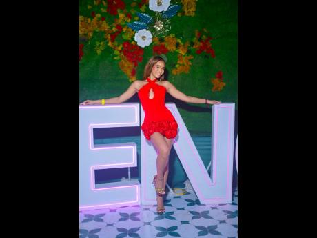 Above: Model and entertainer Kadejah ‘AnnaleaX’ Anderson shows off her legs in a red mini dress with floral detailing.