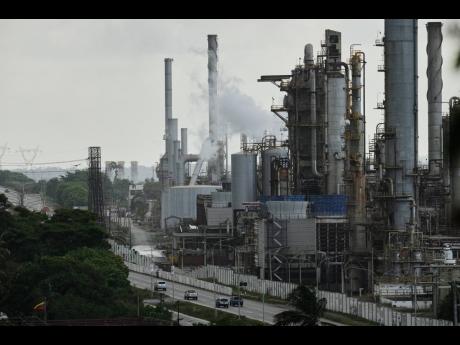 Vehicles drive past the El Palito refinery in Puerto Cabello, Venezuela, Sunday, December 2025. (AP Photo)