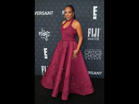 Sheryl Lee Ralph dons a deep burgundy Tony Ward Couture gown with handcrafted 3D embroidered motifs and jewellery by Selim Mouzannar. 