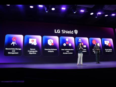Angela Gozenput of home appliances and solution marketing and Aaron Westbrook of media entertainment and solution marketing, talk during an LG Electronics news conference ahead of the CES tech show Monday, January 2026, in Las Vegas. (AP Photo)