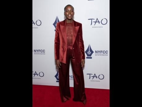 Lupita Nyong’o wears a Alicia + Olivia by Stacey Bendet Silas velvet blazer, Taeeyn lace bodysuit and Kennedy trousers to the New York Film Critics Circle Awards at Tao Downtown on Tuesday, in New York. 