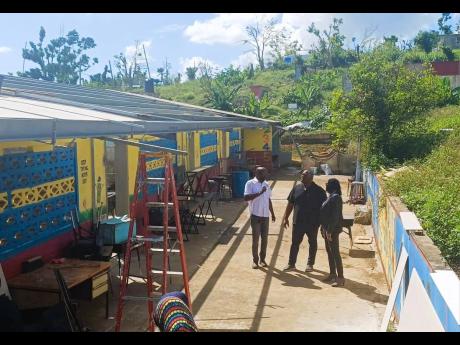 Senator Marlon Morgan (centre), parliamentary secretary in the Ministry of Education, Skills, Youth and Information; Susan Nelson Smith (right), regional director at the ministry for Region Five; and Dameon Sinclair, managing director at the Southern Contr
