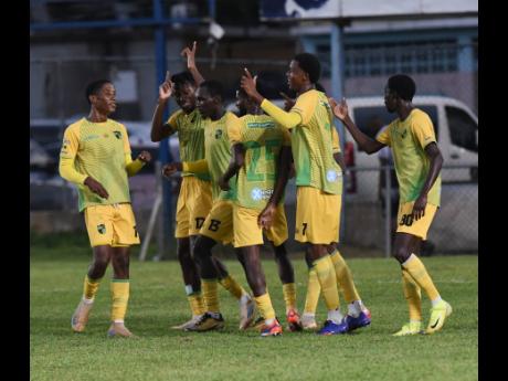 Treasure Beach FC players celebrate a goal against Molynes United during their Jamaica Premier League football match at he Drewsland stadium on Sunday.