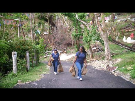 Intcomex Jamaica brought early Christmas cheer to over 100 families in Cave District, Westmoreland, on December 13, as part of its six-month adoption of the community to assist with post-Hurricane Melissa recovery.  