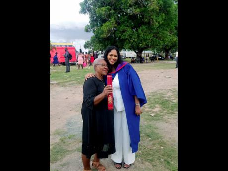 Credit: Contributed Joan Crooks (right) embraces her granddaughter Marianna Crooks at her graduation last week at The University of the West Indies, Mona.