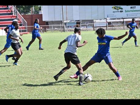 Midfield action from one of the matches in the annual Tarania ‘Plum Plum’ Clarke Girl Power Invitational tournament held last Friday at the Anthony Spaulding Sports Complex in Arnett Gardens, Kingston.