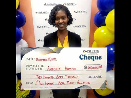 Credit: Contributed Infiniti Co-operative Credit Union’s first-place winner Antonia Hudson holds her presentation cheque, a share of the $500,000 Merry Money Promotion prize.