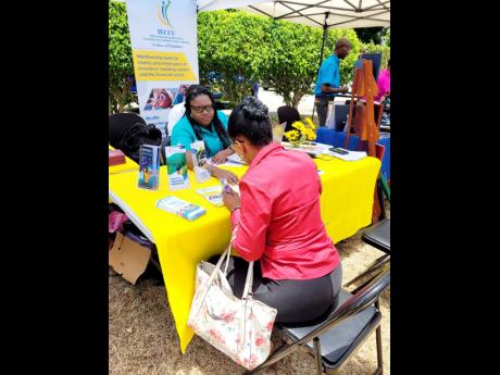  IECCU staff provide one-on-one financial guidance during a 2025 member outreach event, meeting members where they are to support their goals.