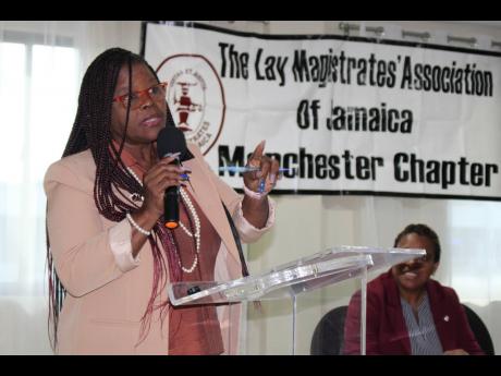 Newly installed President of the Lay Magistrates’ Association of Jamaica, Paulette Kirkland, delivers the keynote address at the half-yearly meeting of the Manchester Chapter of the LMAJ, held on January 22 at the Golf View Hotel in Mandeville. 