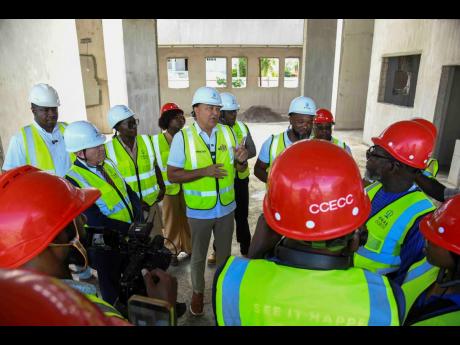 Dr Christopher Tufton, Minister of Health and Wellness speaks with the media after touring the Greater Portmore Health Centre on Wednesday.