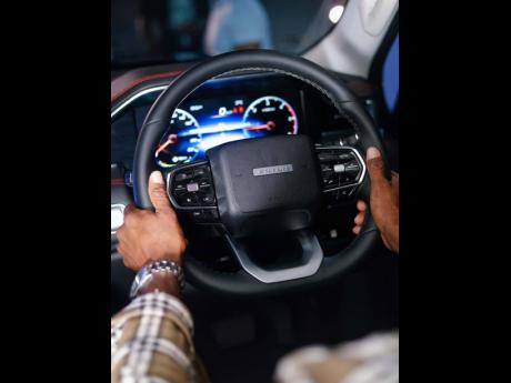 The driver’s perspective inside the Tunland V9, featuring the steering wheel controls and 7-inch, full-colour digital instrument cluster.