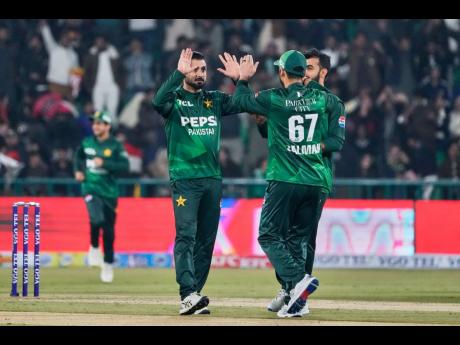 Pakistan’s Abrar Ahmed (left)  celebrates with teammates after the dismissal of Australia’s Cooper Connolly during the first T20 cricket match between Pakistan and Australia, in Lahore, Pakistan, Thursday, January 29, 2026.
