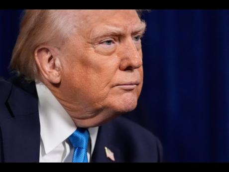 US President Donald Trump listens to a question during a news conference at Mar-a-Lago on January 3, 2026, in Palm Beach, Florida.