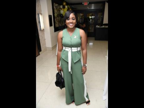Guidance counsellor Shanakaye Blake of Pembroke Hall Primary School dons a green and white pantsuit from Milan Fashion.