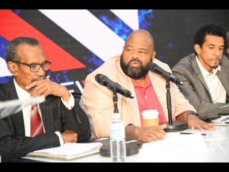 From left: Dr Ian Blair, acting chairman; Solomon Sharpe, CEO; and Richard Bair, COO, address shareholders at the Main Event Entertainment Group Limited annual general meeting at the Spanish Court Hotel on St Lucia Ave in New Kingston on Thursday, July 6, 