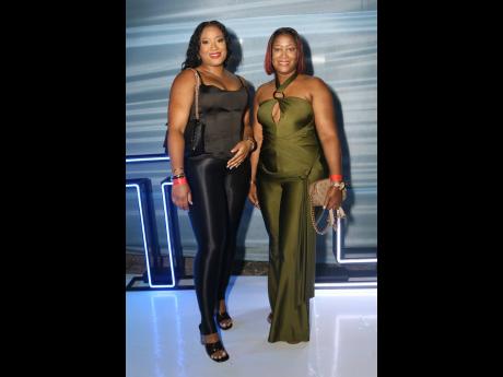 Equipment dispatcher Kadian Samuels (left) and her sister Jeanelle show that sisters make the best party dates.