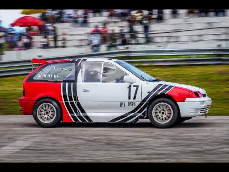 Don Gilbert, in his Suzuki Swift GTI, passes the Dover grandstand. His steady performance throughout the year earned him enough points to secure the Modified Production 1 championship.