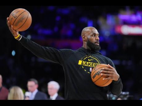 Los Angeles Lakers forward LeBron James warms up before the team’s NBA basketball game against the Golden State Warriors Saturday, February 7, 2026, in Los Angeles. 