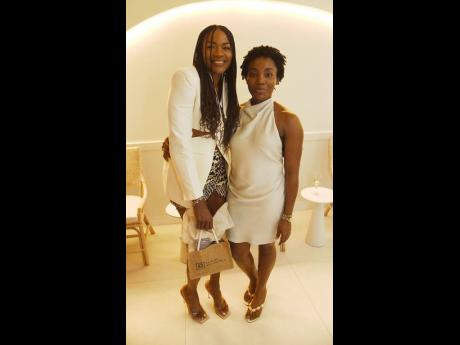 Credit: Ian Allen Debbie Hall (left), fitness trainer, shares a moment with Dr Mariesha Terrelonge Lee.