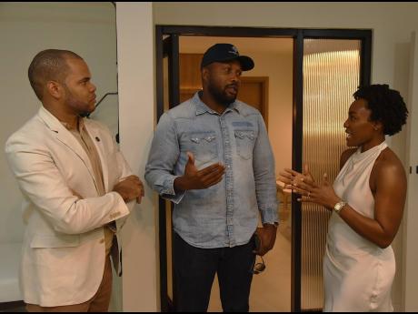 Credit: Ian Allen Co-founders of FUTURE Medical and Aesthetics Dr Marcus Lee (left), functional integrative physician, and Dr Mariesha Terrelonge Lee, aesthetic laser and regenerative physician, engage in conversation with Agent Sasco (centre).