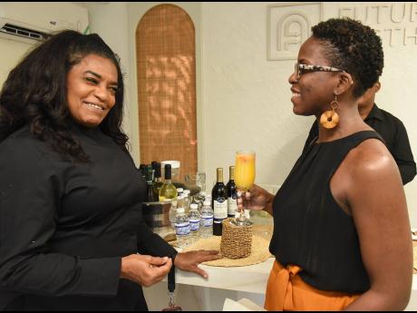 Credit: Ian Allen Chef Jacqui Tyson (left) shares a lively moment with Jahmai Mesquita.