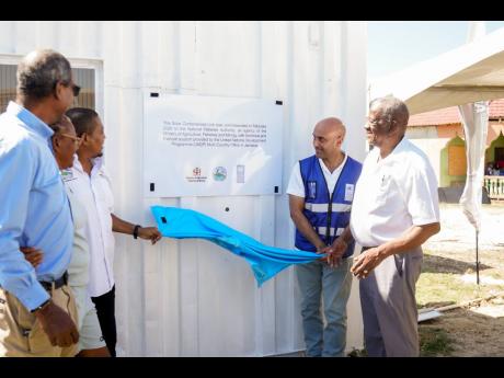 (L-R) National Fisheries Authority CEO, Dr Gavin Bellamy; Claudene Ebanks, warden, Galleon Fishing Sanctuary; Minister of Agriculture, Fisheries and Mining, Floyd Green; UNDP Resident Representative Dr Kishan Khoday; Minister of State in the Ministry of