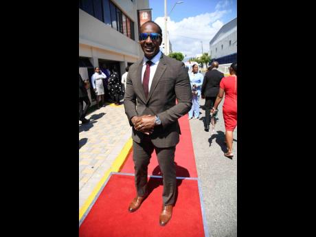 Alando Terrelonge, minister of state in the Ministry of Foreign Affairs and Foreign Trade and member of parliament for St Catherine East Central, pauses for a photo-op in his coffee-coloured suit from Hugo Boss. 