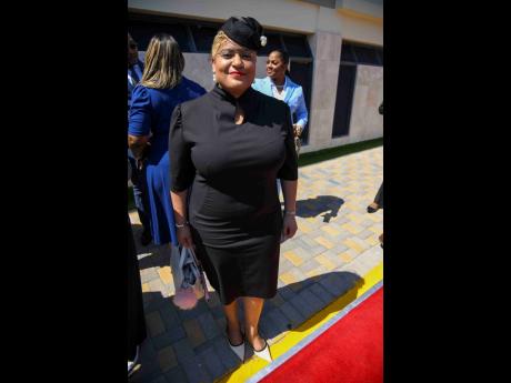 Dressed in black, Krystal Lee, minister of state in the Ministry of Health and Wellness, and member of parliament for St Ann North Western, strikes a pose for the camera.
