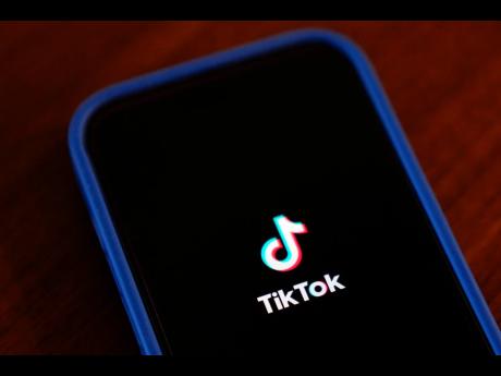 The TikTok app logo is shown on an iPhone.