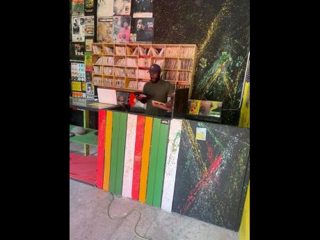 Credit: Contributed Ainsworth ‘Mitchie’ Williams at Mitchie’s Record Shop, 136D Orange Street, downtown Kingston.
