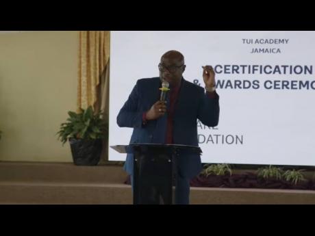 Dr Darien Henry, the principal of Montego Bay Community College, addressing the Institute of Vocational Education and Skills Training Limited’s [INVEST] graduation ceremony at the Mt Salem Seventh-day Adventist Church in Montego Bay, St James, on Wednesd