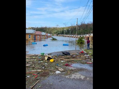 Several homes in Phase 2 of The Estuary remaining under water a day after the passage of the Category 5 Hurricane Melissa last October.