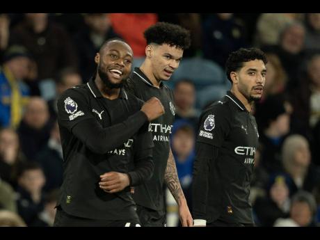 
Manchester City’s Antoine Semenyo (left) reacts after scoring during the Premier League football match against Leeds United in Leeds, England, yesterday.