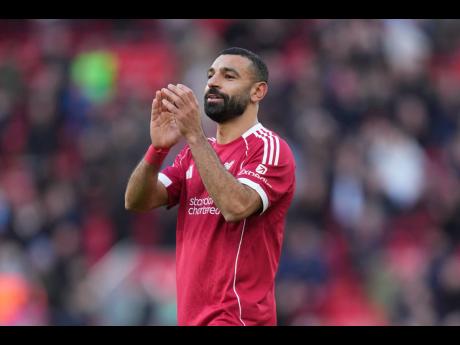 Liverpool’s Mohamed Salah walks off the pitch after the Premier League football match against West Ham United in Liverpool, England, yesterday.