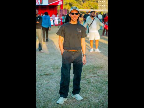 Founder of the Sweat and Salty run club Justin Lowe keeps it classic in black denim and a bold graphic cap.