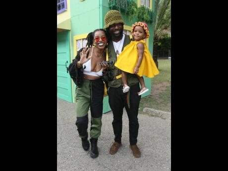 Fashion designer and owner of Quaint Bags Gabrielle Clarke enjoys a family outing with Andre Gayle and their bundle of joy, baby LuLu Gayle.