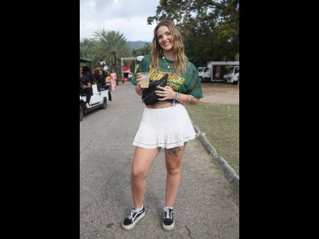 Booking her ticket to Jamaica to experience Lost In Time, Shay Huybre from Belgium reps in a Jamaican-inspired jersey.