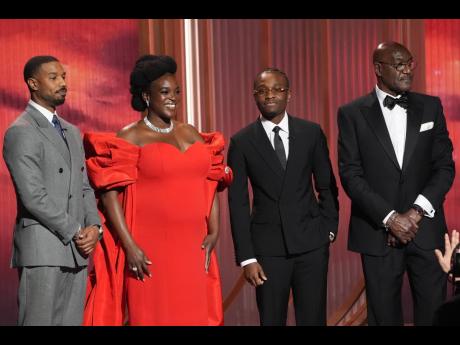 Delroy Lindo (right), who is of Jamaican roots, is joined by ‘Sinners’ castmates (from left) Michael B. Jordan, Wunmi Mosaku and Miles Caton, during the 32nd Annual Actor Awards on Sunday at the Shrine Auditorium and Expo Hall in Los Angeles. 