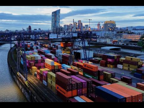 Containers are stored in a cargo terminal in Frankfurt, Germany, Monday, February 23, 2026. (AP Photo/Michael Probst)