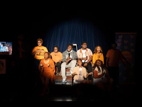 Genesis Praise Squad join Johnmark Wiggan (centre) on stage for a surprise flash-mob style performance that opened the ‘By Fire’ media launch.