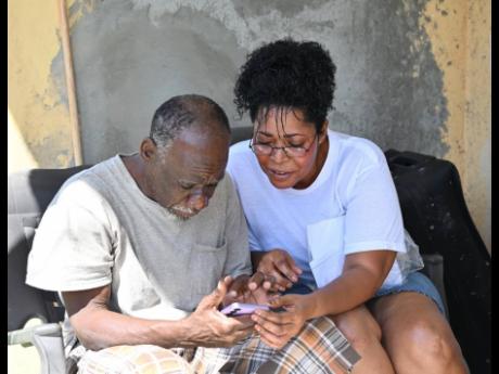 Credit: Ashley Anguin/Photographer
Rose Marie Glaze, nurse practitioner interacts with Kemelia Campbell, who she recently took off the streets of Montego Bay, St James in an act of ongoing generosity. Campbell has no known relatives living in the area, and was not able to find lodging at t