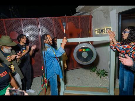 Contributed Photos
Guests look on as Stephen Marley (left) strikes a gong, signalling the official reopening of Tuff Gong Studio in Kingston on Thursday, to the delight of his sister, Cedella Marley.