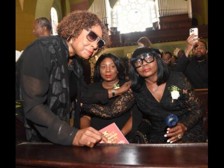 From left: Minister of Culture, Gender, Entertainment and Sport Olivia Grange, Sly Dunbar’s daughter, Natasha and wife, Thelma.