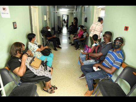Patients wait to be served inside the eye clinic at St Josephs Hospital in Kingston yesterday.