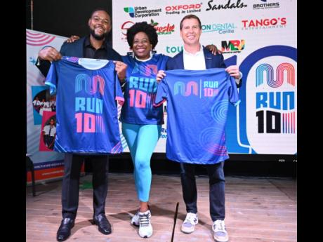 From left: Richard Vernon, the mayor of Montego Bay; Janet Silvera, chairperson of the Jill Stewart MoBay City Run (JSMCR); and Adam Stewart, executive chairman of Sandals Resorts International, display jerseys to be worn by participants in the annual even