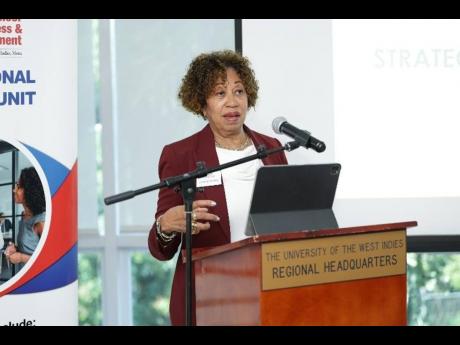 Diane Edwards, director of the Professional Services Unit at the Mona School of Business and Management (MSBM), delivers opening remarks at the MSBM Strategic Insights Seminar Series – Seminar 2 held at The University of the West Indies Regional Headquar