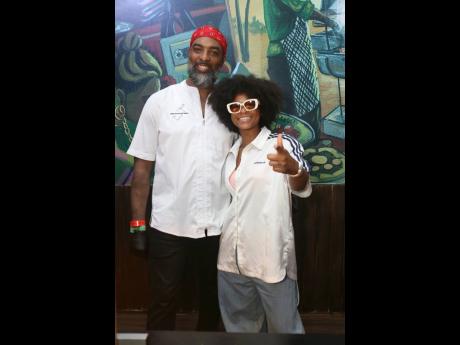 Chef Scotley Innis (left) poses with reggae star Lila Iké.