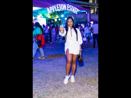 Allison Callam, sales and marketing director, VIP Attractions, shows off her crisp, relaxed style as she poses for the camera with a cocktail in hand. 